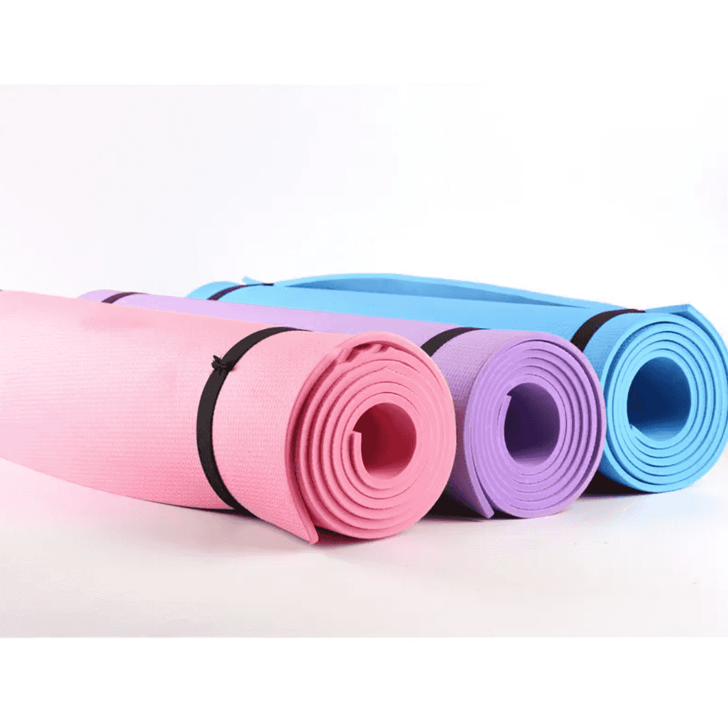 Set of pastel pink, purple, and blue yoga mats rolled up with black straps, designed for versatile workout routines and joint cushioning.