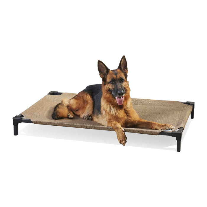 German Shepherd dog lying on a beige elevated dog bed with black frame, breathable fabric, no-tool assembly, suitable for indoor and outdoor use